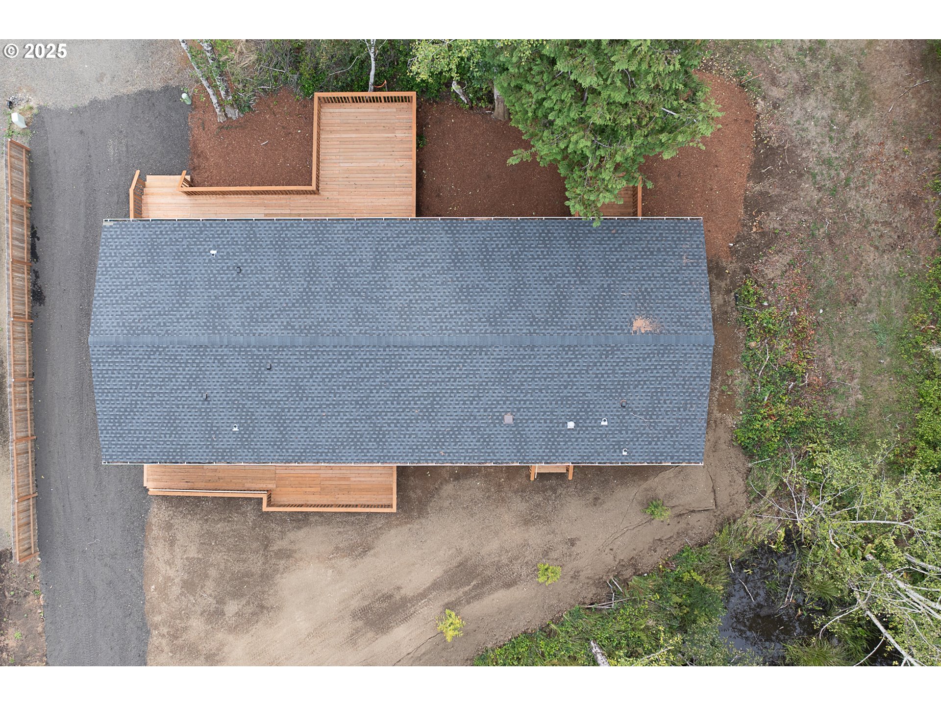 352 North Falcon Street Rockaway Beach, OR 97136 - Photo 27 of 32 an aerial view of a house with a yard