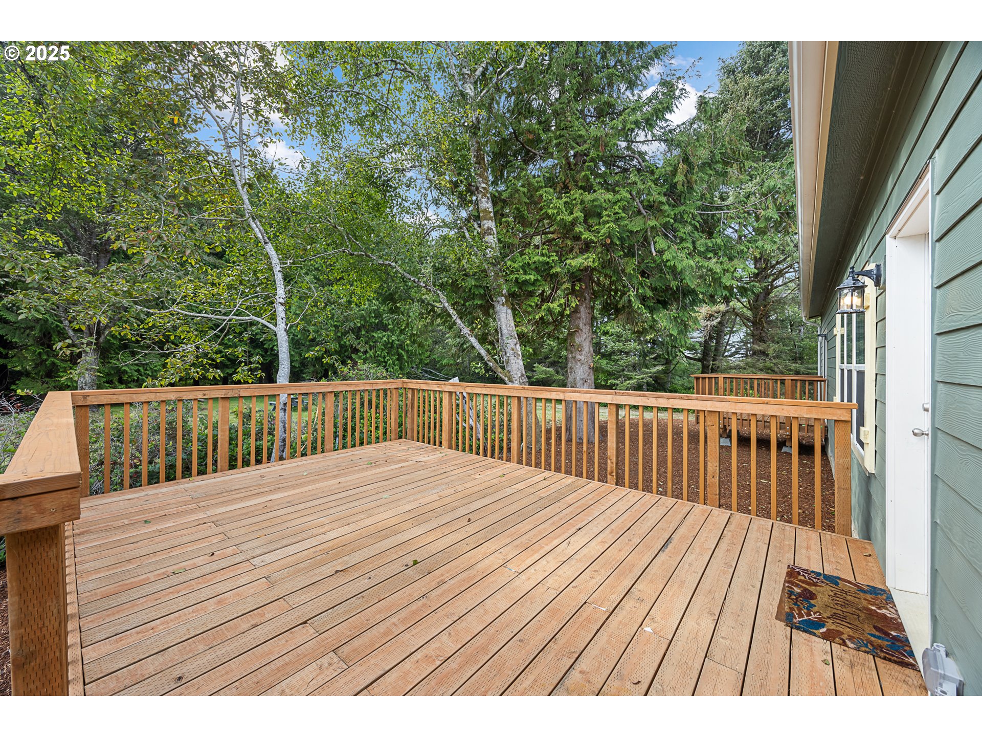 352 North Falcon Street Rockaway Beach, OR 97136 - Photo 3 of 32 a view of balcony with wooden floor