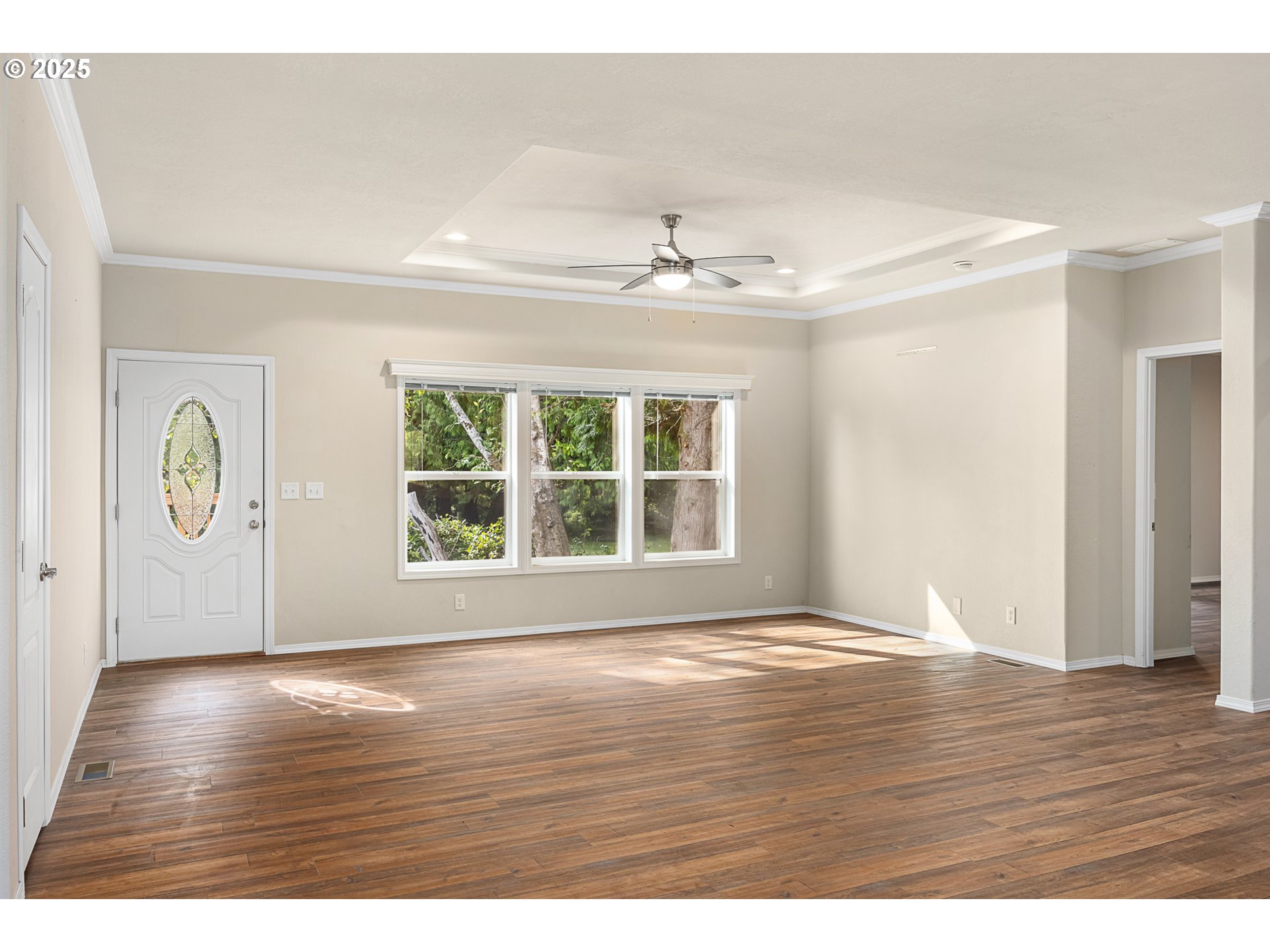 352 North Falcon Street Rockaway Beach, OR 97136 - Photo 10 of 32 a view of an empty room with wooden floor and a window