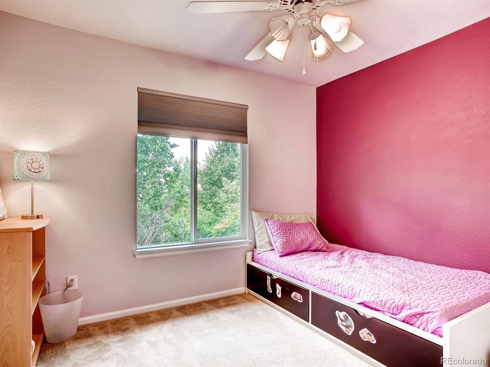 10824 Towerbridge Road Highlands Ranch, CO 80130 - Photo 17 of 33 a bedroom with a bed and a window