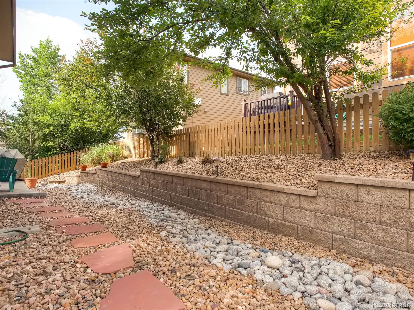 10824 Towerbridge Road Highlands Ranch, CO 80130 - Photo 24 of 33 a view of a yard with trees
