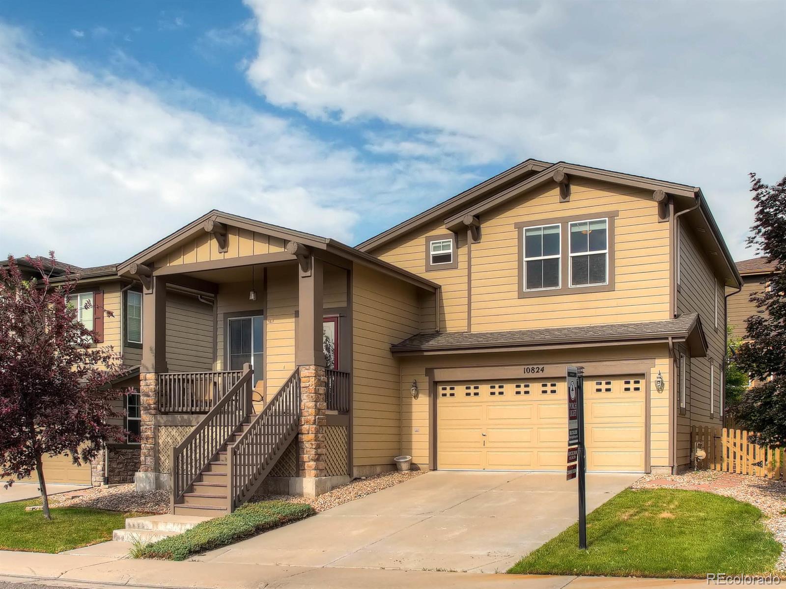 10824 Towerbridge Road Highlands Ranch, CO 80130 - Photo 32 of 33 a front view of a house with a yard