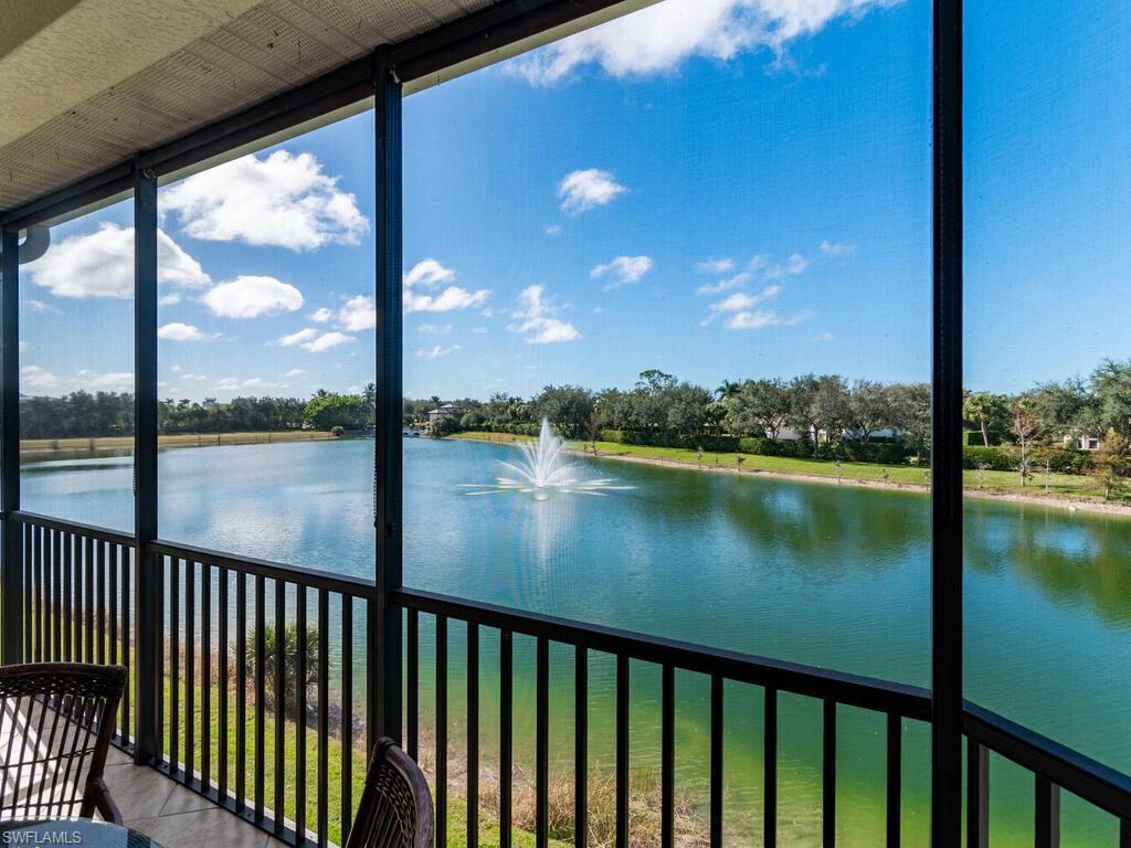 7869 Hawthorne Drive, Unit 303 Naples, FL 34113 - Photo 21 of 50 Unfurnished sunroom featuring a water view