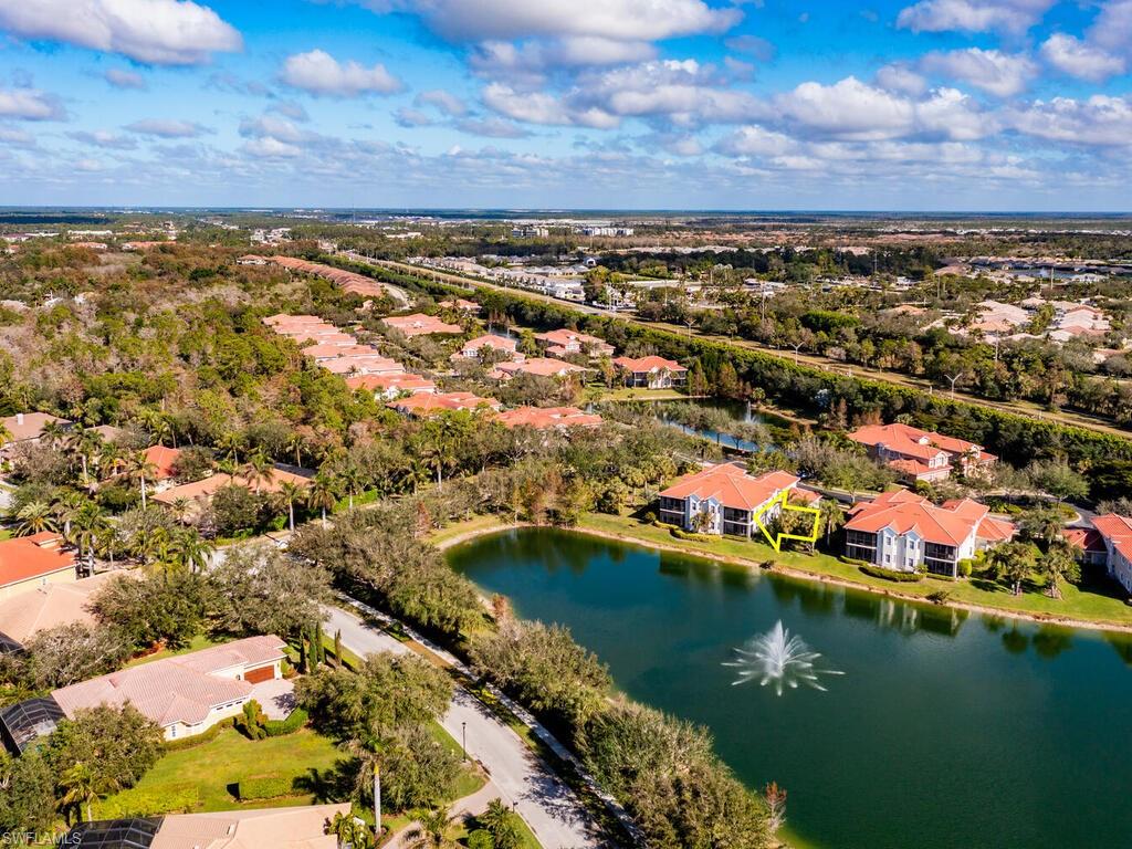 7869 Hawthorne Drive, Unit 303 Naples, FL 34113 - Photo 35 of 50 Drone / aerial view featuring a water view