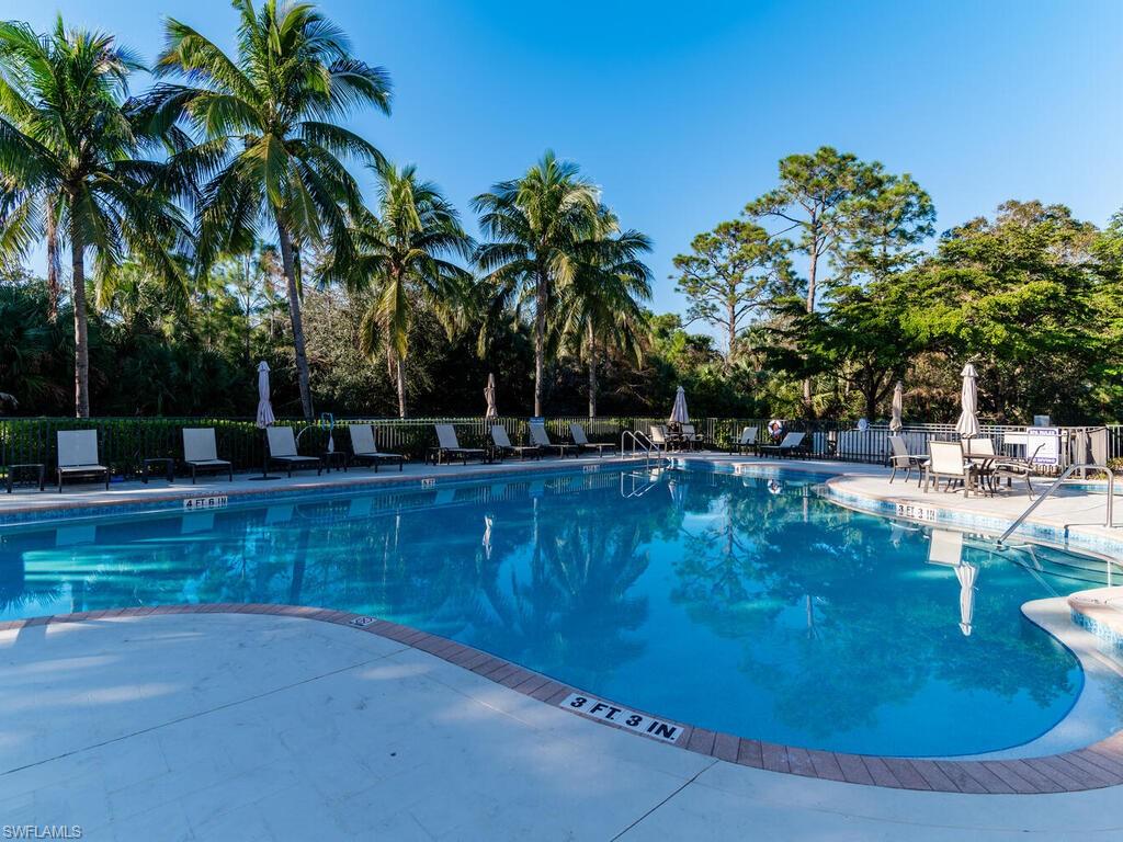 7869 Hawthorne Drive, Unit 303 Naples, FL 34113 - Photo 41 of 50 View of swimming pool featuring a patio area