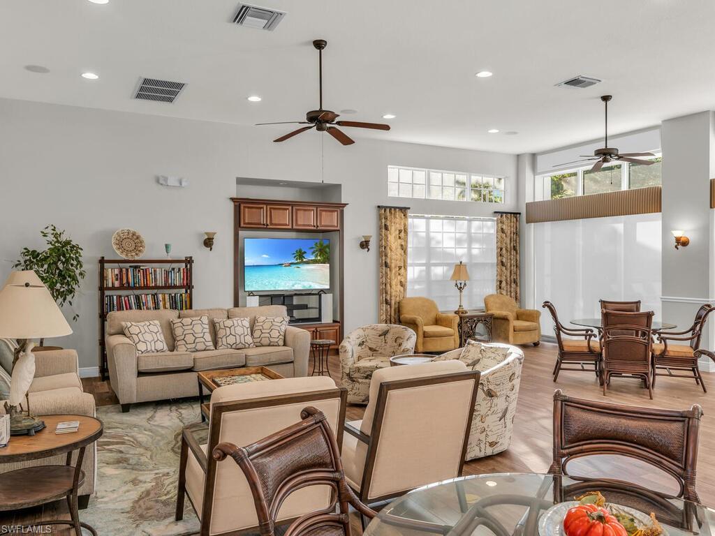 7869 Hawthorne Drive, Unit 303 Naples, FL 34113 - Photo 43 of 50 Living room featuring ceiling fan and light hardwood / wood-style floors