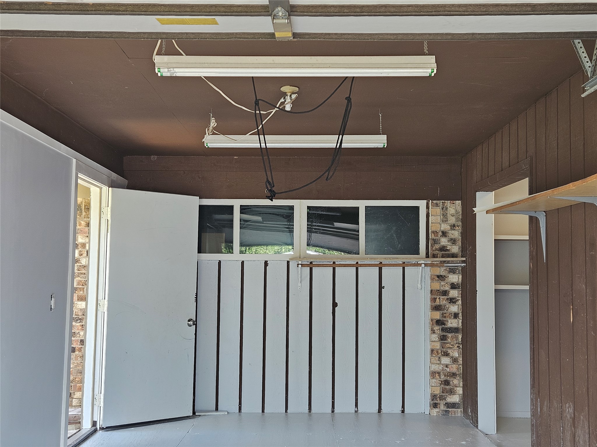 806 Ranch Road, Unit A Georgetown, TX 78628 - Photo 15 of 24 Functional garage offers convenient storage solutions and direct outdoor access.