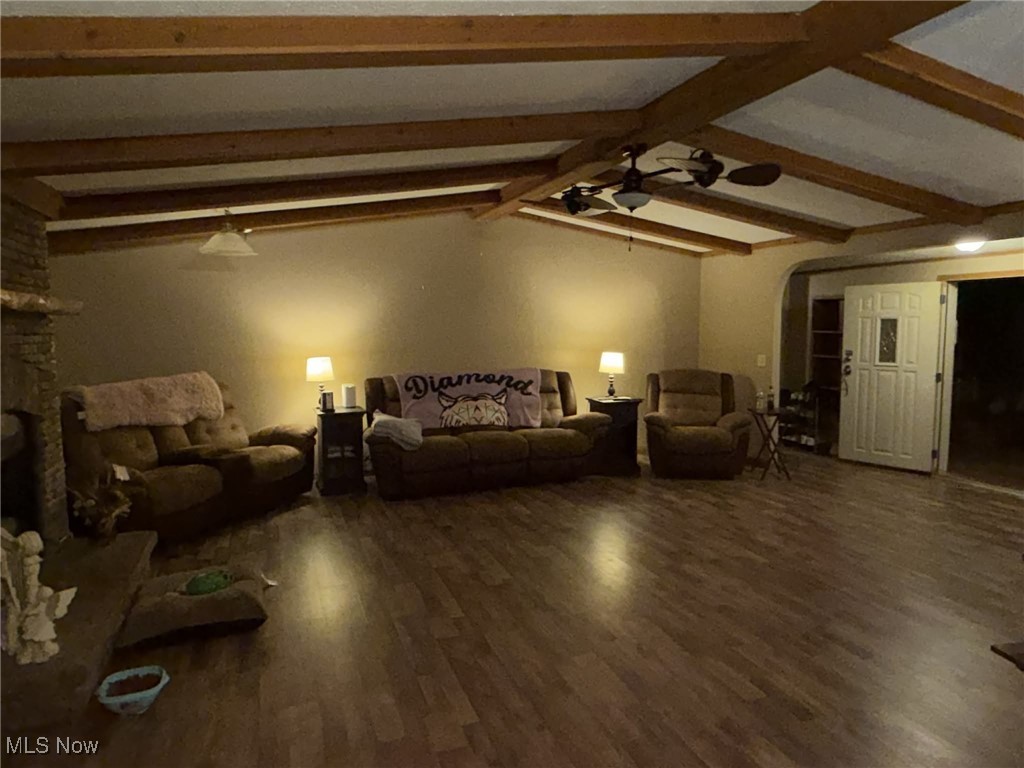 56 3rd Street Rayland, OH 43943 - Photo 35 of 46 Living area with dark wood-type flooring, a ceiling fan, and arched walkways