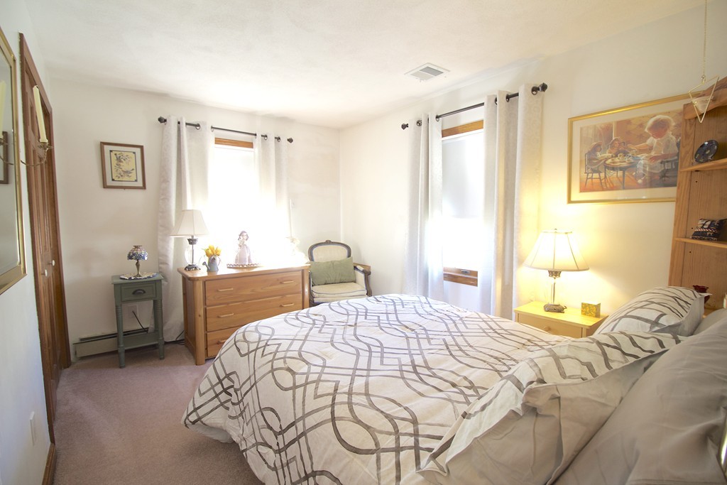 41 Lodge Road Newton, MA 02465 - Photo 12 of 25 a bedroom with a bed and a table