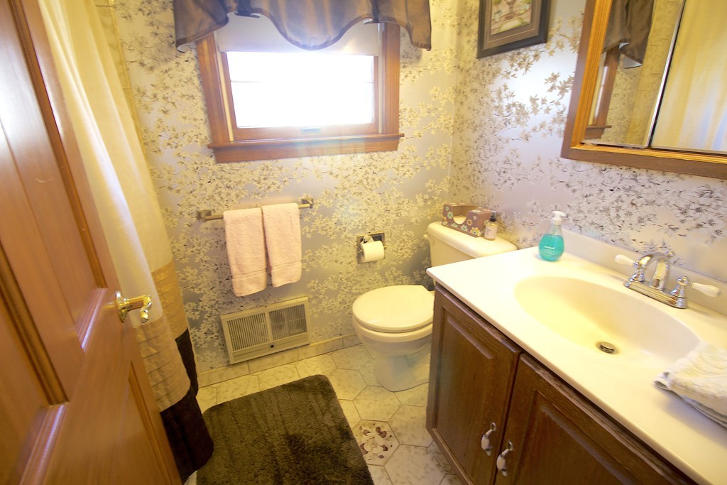 41 Lodge Road Newton, MA 02465 - Photo 15 of 25 a bathroom with a sink and a mirror