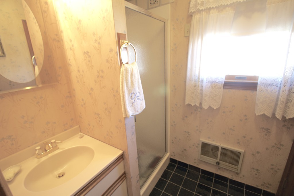 41 Lodge Road Newton, MA 02465 - Photo 18 of 25 a bathroom with a sink and a mirror