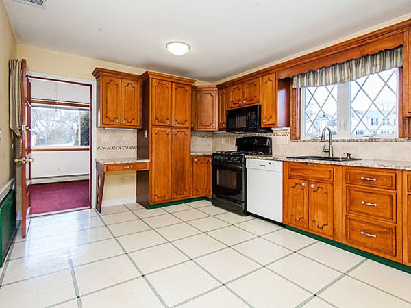 41 Lodge Road Newton, MA 02465 - Photo 25 of 25 a kitchen with stainless steel appliances granite countertop a refrigerator sink and cabinets