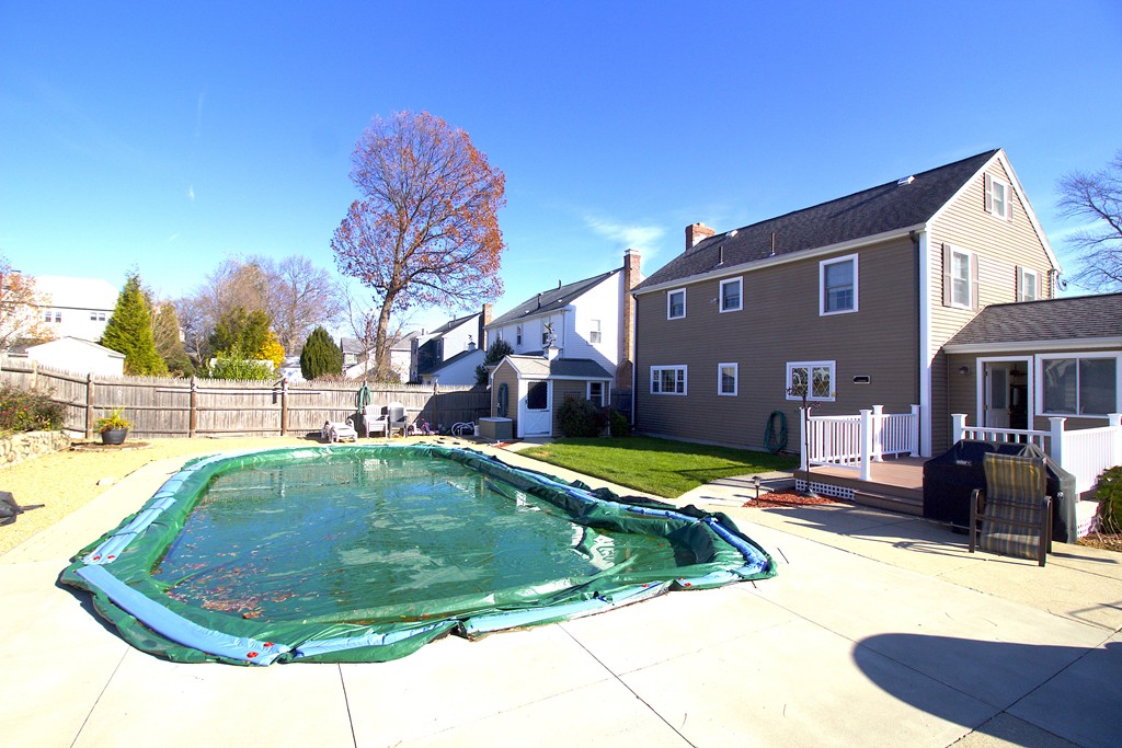 41 Lodge Road Newton, MA 02465 - Photo 3 of 25 a swimming pool with outdoor seating and yard