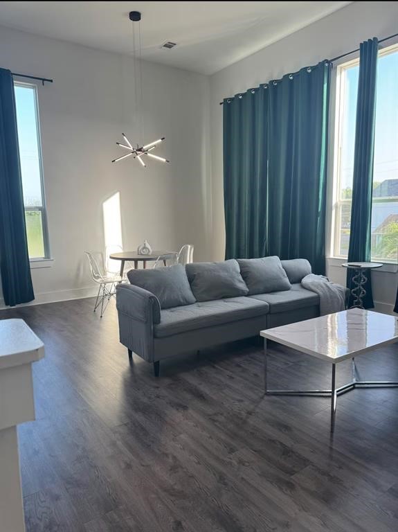 3610 Dreyfus Street, Unit A Houston, TX 77021 - Photo 7 of 20 a living room with couches and kitchen view with wooden floor