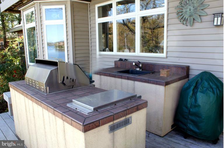 1421 Oak Bluff Road Edgewater, MD 21037 - Photo 1 of 30 a view of an outdoor kitchen