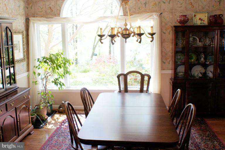 1421 Oak Bluff Road Edgewater, MD 21037 - Photo 26 of 30 a view of a dining room with furniture window and outside view