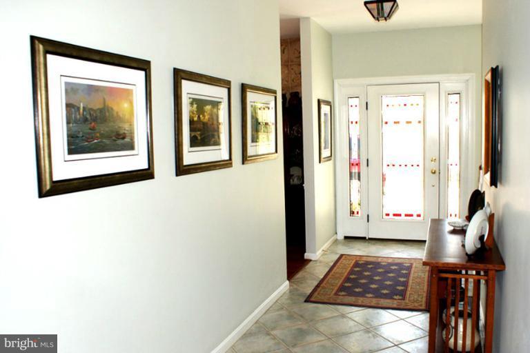 1421 Oak Bluff Road Edgewater, MD 21037 - Photo 4 of 30 a view of hallway with window and a rug