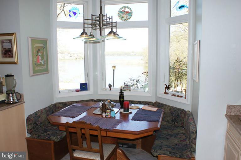 1421 Oak Bluff Road Edgewater, MD 21037 - Photo 7 of 30 a view of a dining room with furniture window and outside view