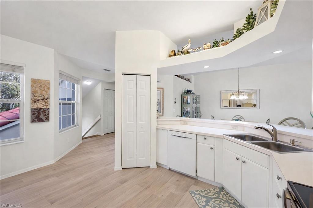 10801 Halfmoon Shoal Road, Unit 202 Estero, FL 34135 - Photo 7 of 45 (Virtual wall color change and flooring upgrades) Kitchen features stainless steel refrigerator and oven, and pantry, as well as an office nook with plenty of light!