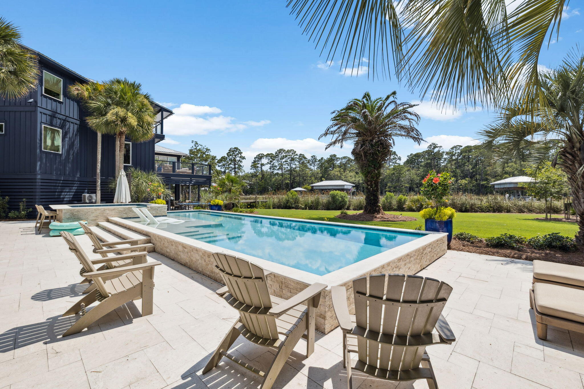 683 Eden Drive Santa Rosa Beach, FL 32459 - Photo 18 of 69 a view of a swimming pool with a patio