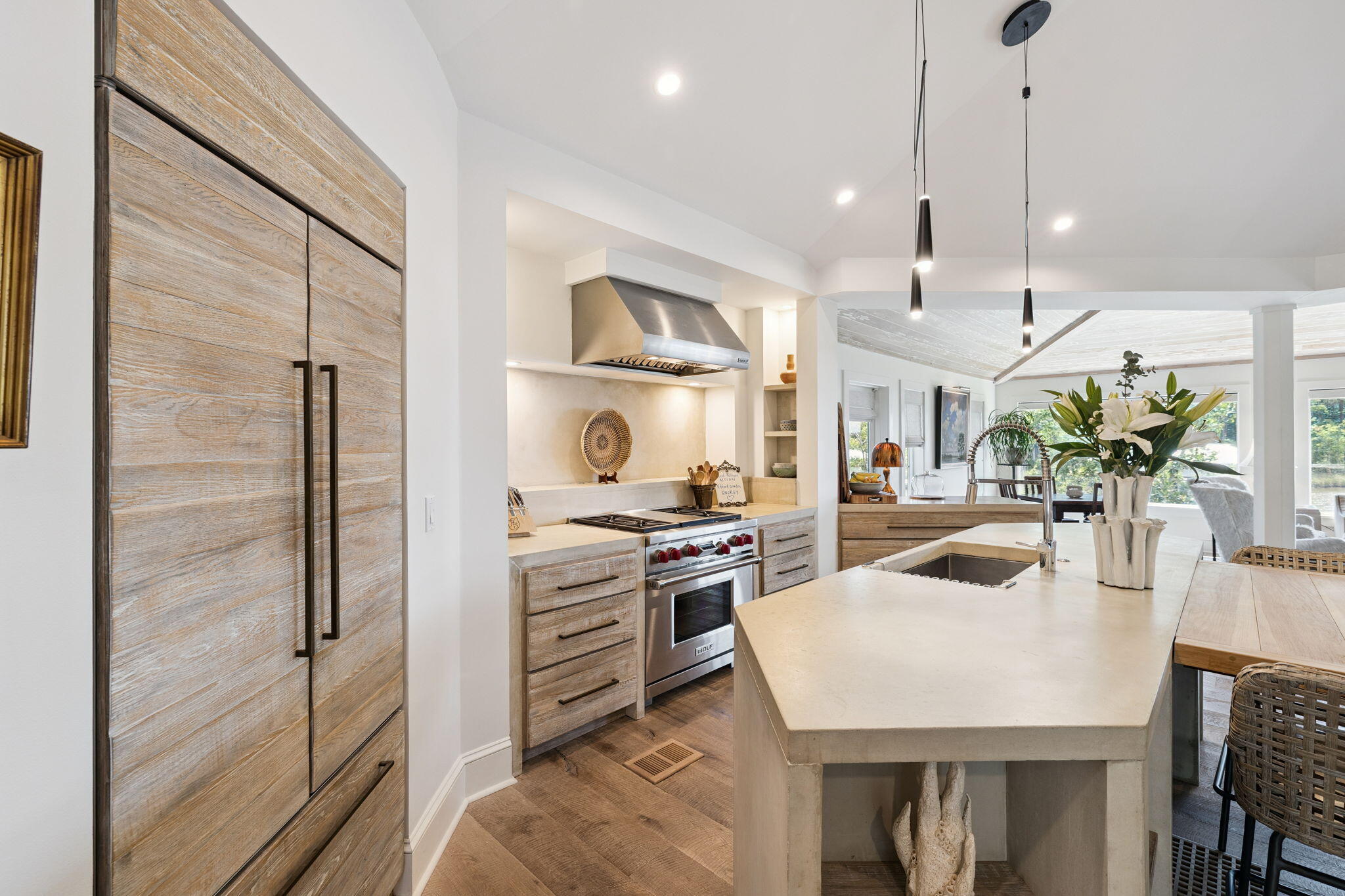683 Eden Drive Santa Rosa Beach, FL 32459 - Photo 32 of 69 a kitchen with stainless steel appliances granite countertop a sink a stove and a refrigerator