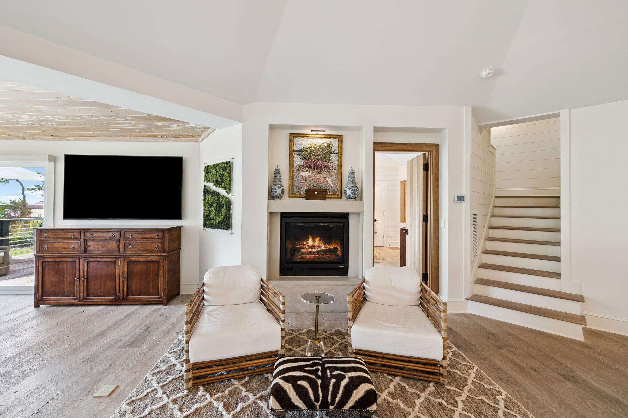 683 Eden Drive Santa Rosa Beach, FL 32459 - Photo 33 of 69 a living room with furniture a flat screen tv and a fireplace