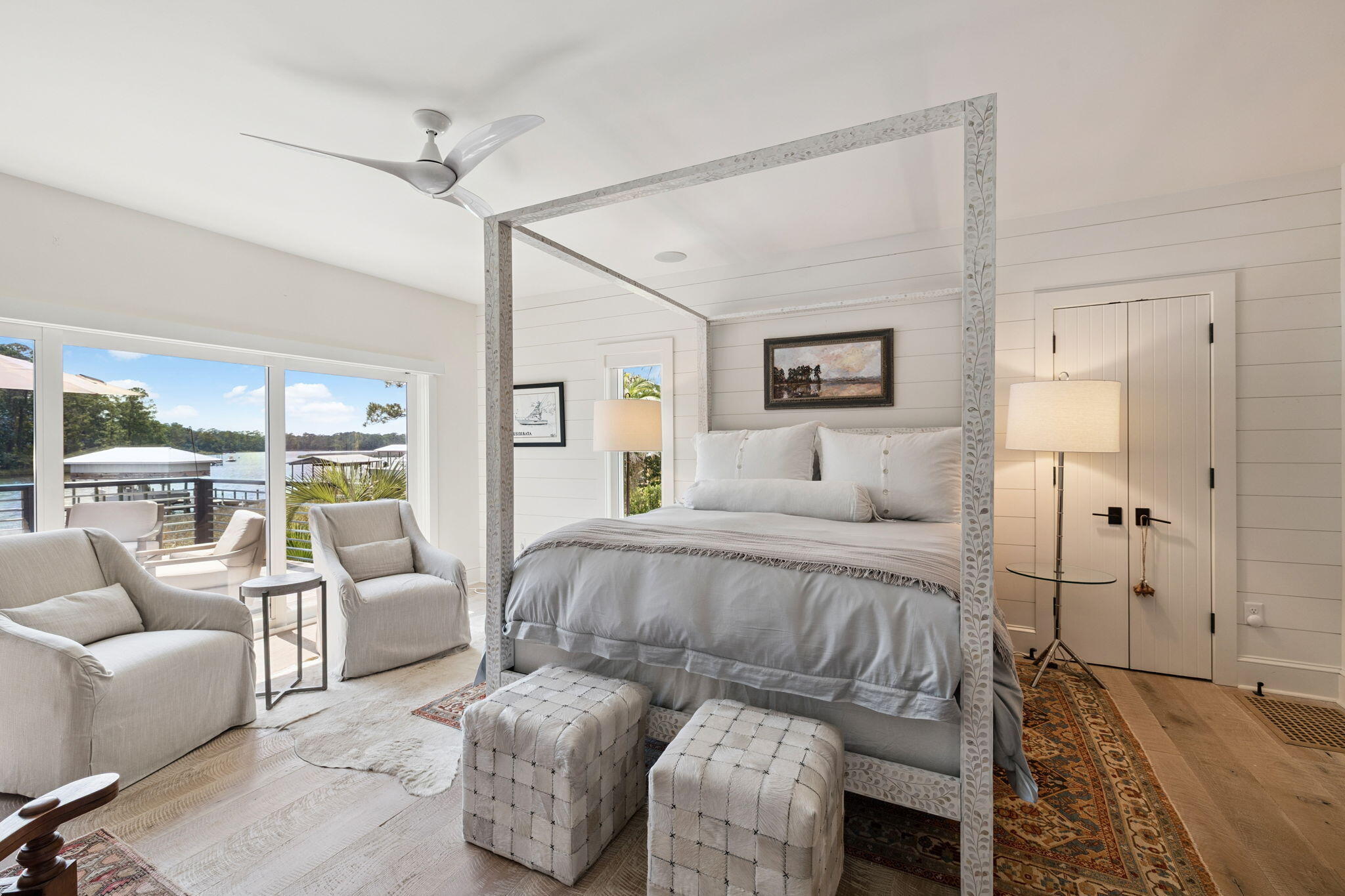 683 Eden Drive Santa Rosa Beach, FL 32459 - Photo 38 of 69 a spacious bedroom with a bed a couch and a view of kitchen