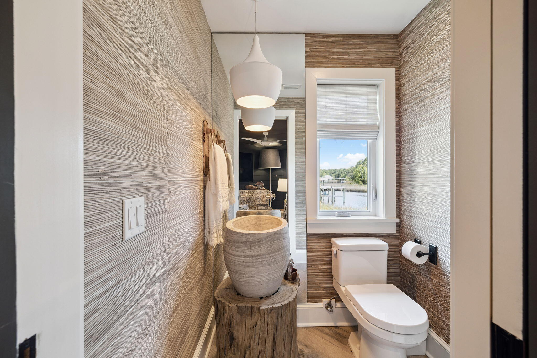 683 Eden Drive Santa Rosa Beach, FL 32459 - Photo 46 of 69 a bathroom with a toilet a sink and mirror