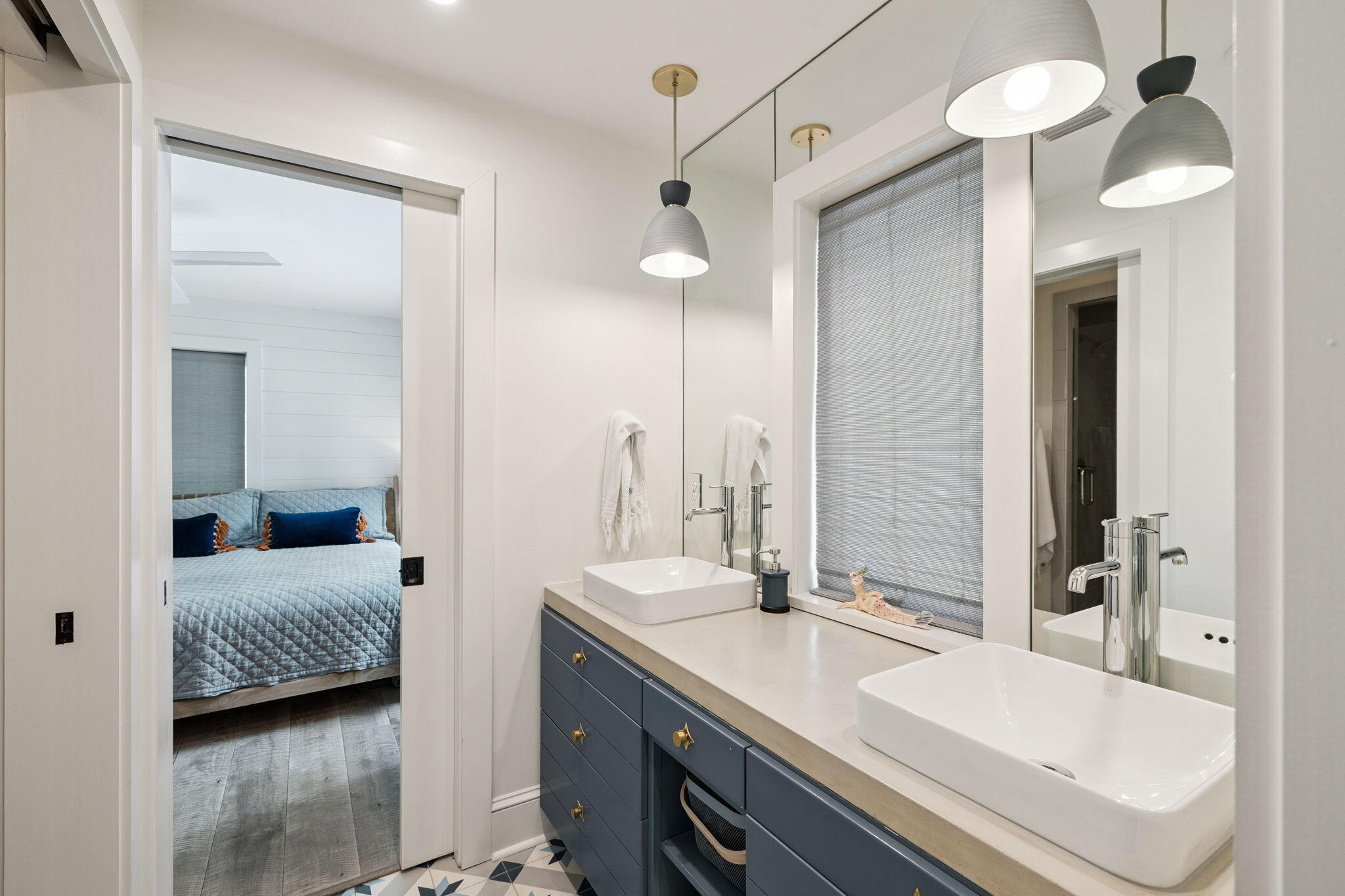 683 Eden Drive Santa Rosa Beach, FL 32459 - Photo 50 of 69 a en suite bathroom with a double vanity sink and a mirror