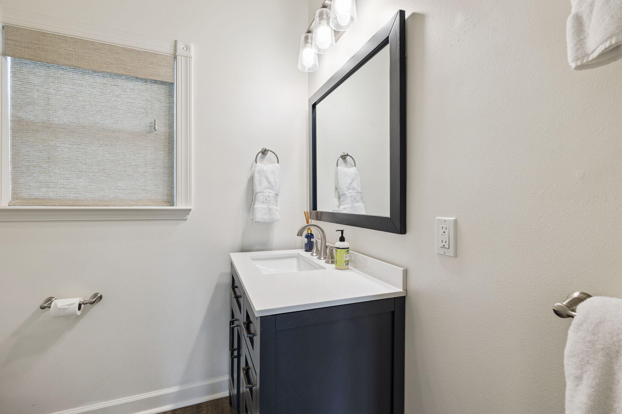 683 Eden Drive Santa Rosa Beach, FL 32459 - Photo 57 of 69 a bathroom with a sink and a mirror