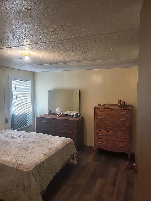 1250 Winn Road Bowie, TX 76230 - Photo 22 of 40 a bedroom with a bed and a window