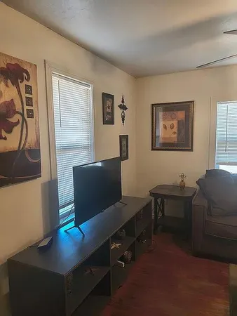 a living room with furniture and a table