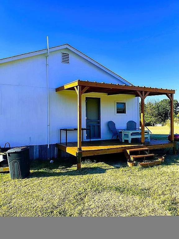 1250 Winn Road Bowie, TX 76230 - Photo 4 of 40 a front view of a house with garden