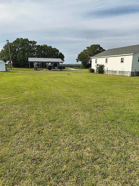 1250 Winn Road Bowie, TX 76230 - Photo 6 of 40 a view of a lake with houses
