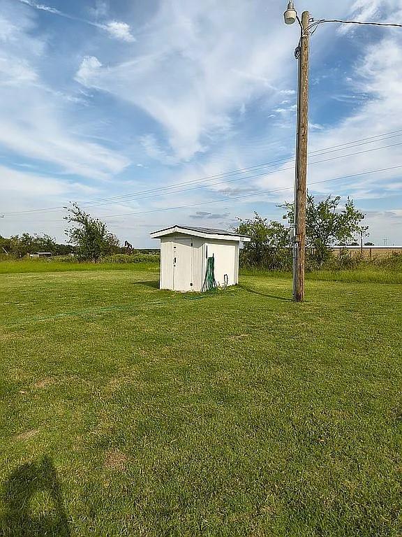 1250 Winn Road Bowie, TX 76230 - Photo 9 of 40 a house view with a big yard