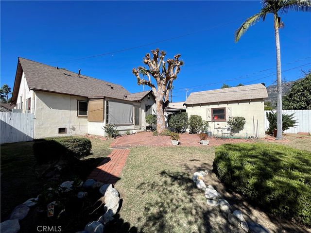 a swimming pool view with a seating space