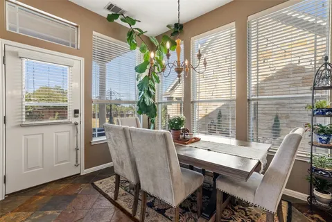 a view of a dining room with furniture window and outside view