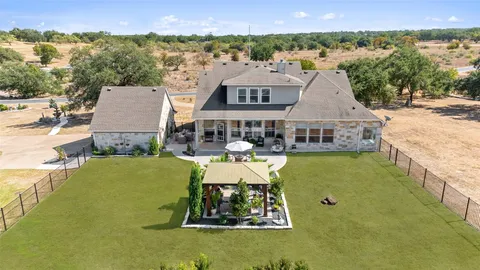 a swimming pool with outdoor seating and yard