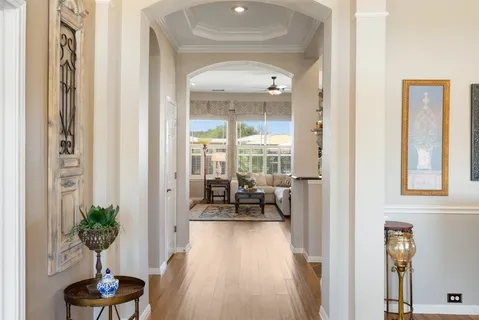 a living room with furniture and potted plant