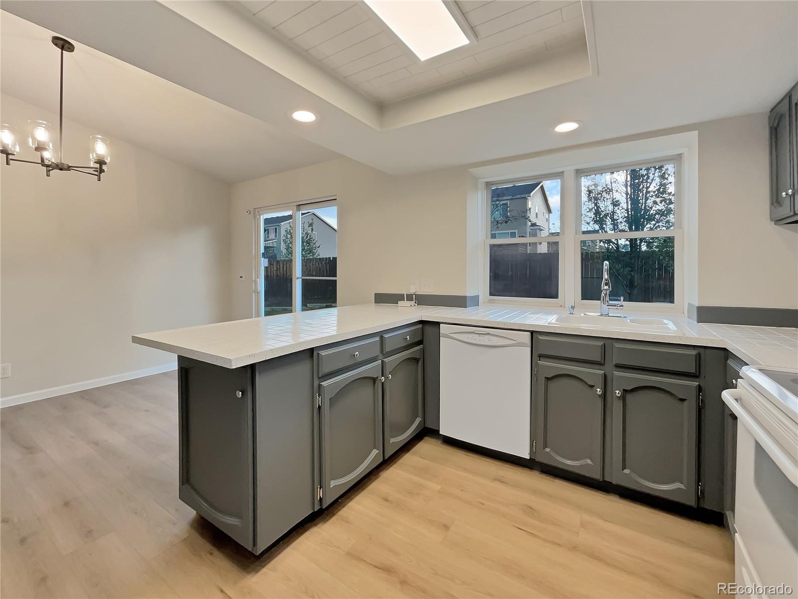 14 Maple Drive Frederick, CO 80530 - Photo 13 of 20 a kitchen with sink stove and microwave