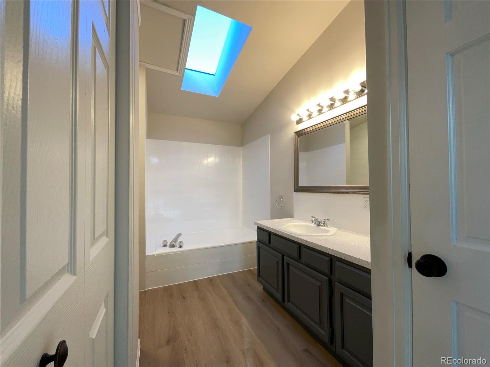 14 Maple Drive Frederick, CO 80530 - Photo 14 of 20 a spacious bathroom with a double vanity sink and a mirror