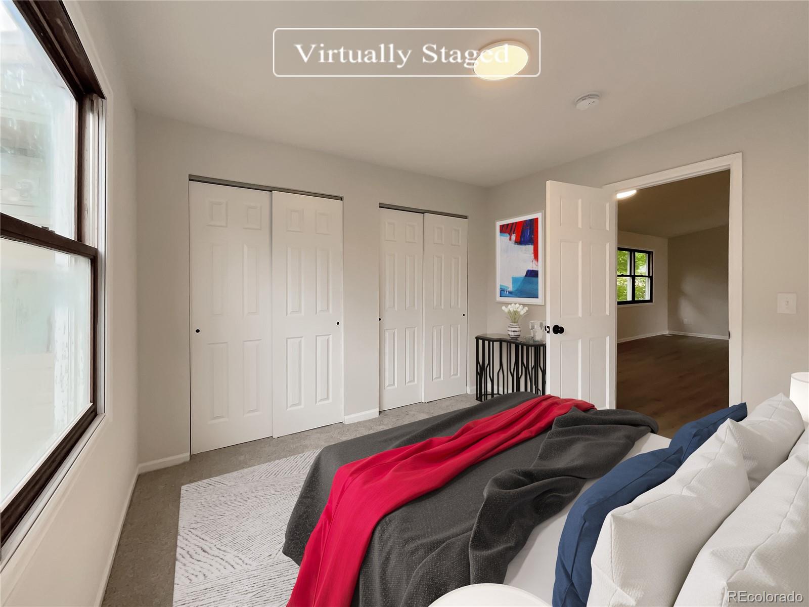 14 Maple Drive Frederick, CO 80530 - Photo 4 of 20 a bed room with a bed and a closet