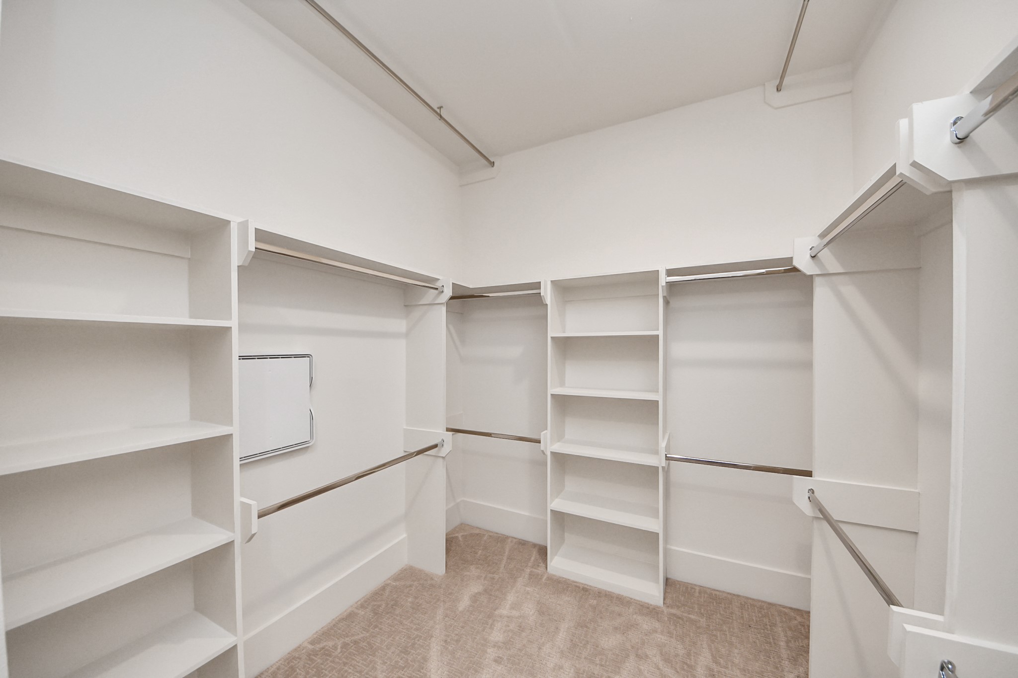 5903 Urban Pines Street Houston, TX 77091 - Photo 42 of 42 a view of walk in closet with empty racks