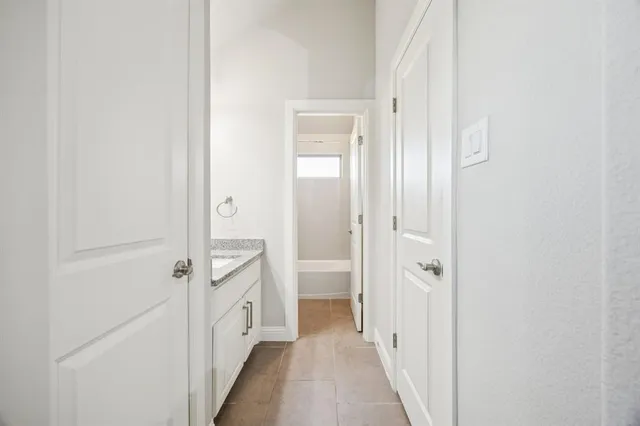 a view of a bathroom from the hallway