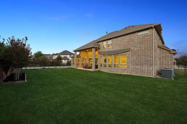 a view of an house with backyard space and garden