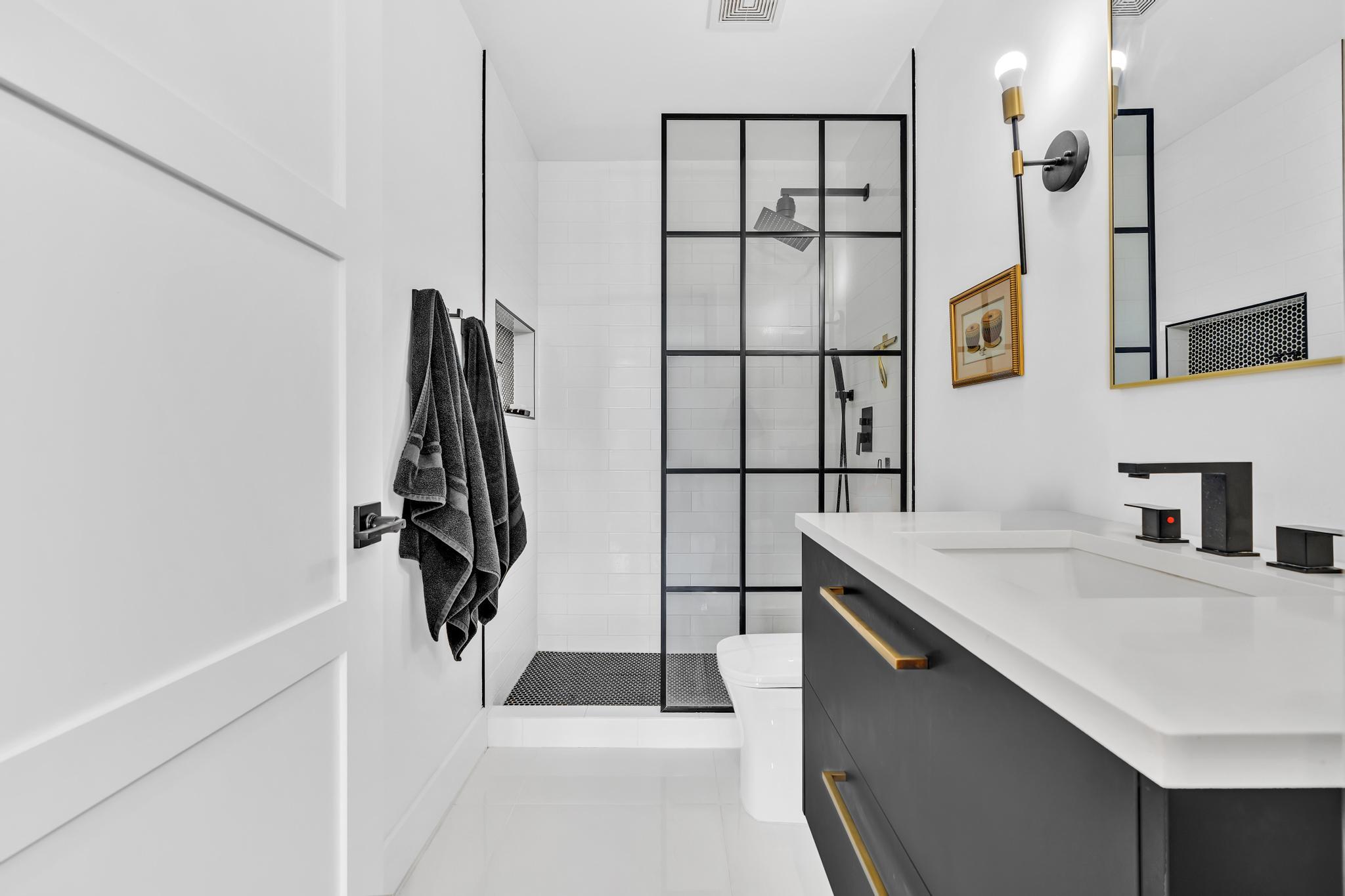 701 East Camino Real, Unit 12G Boca Raton, FL 33432 - Photo 32 of 82 a bathroom with a sink and a shower