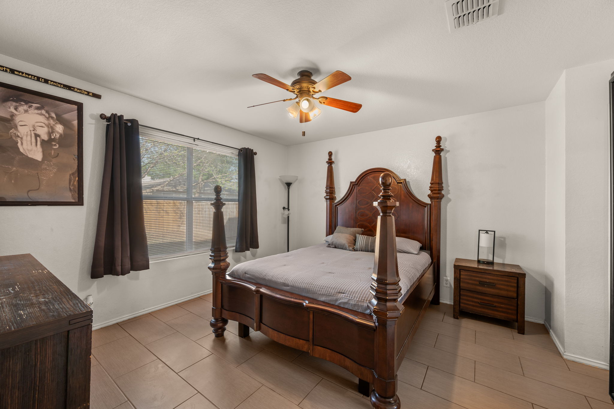 14206 Varrelman Street Austin, TX 78725 - Photo 13 of 27 a bedroom with bed and wooden floor