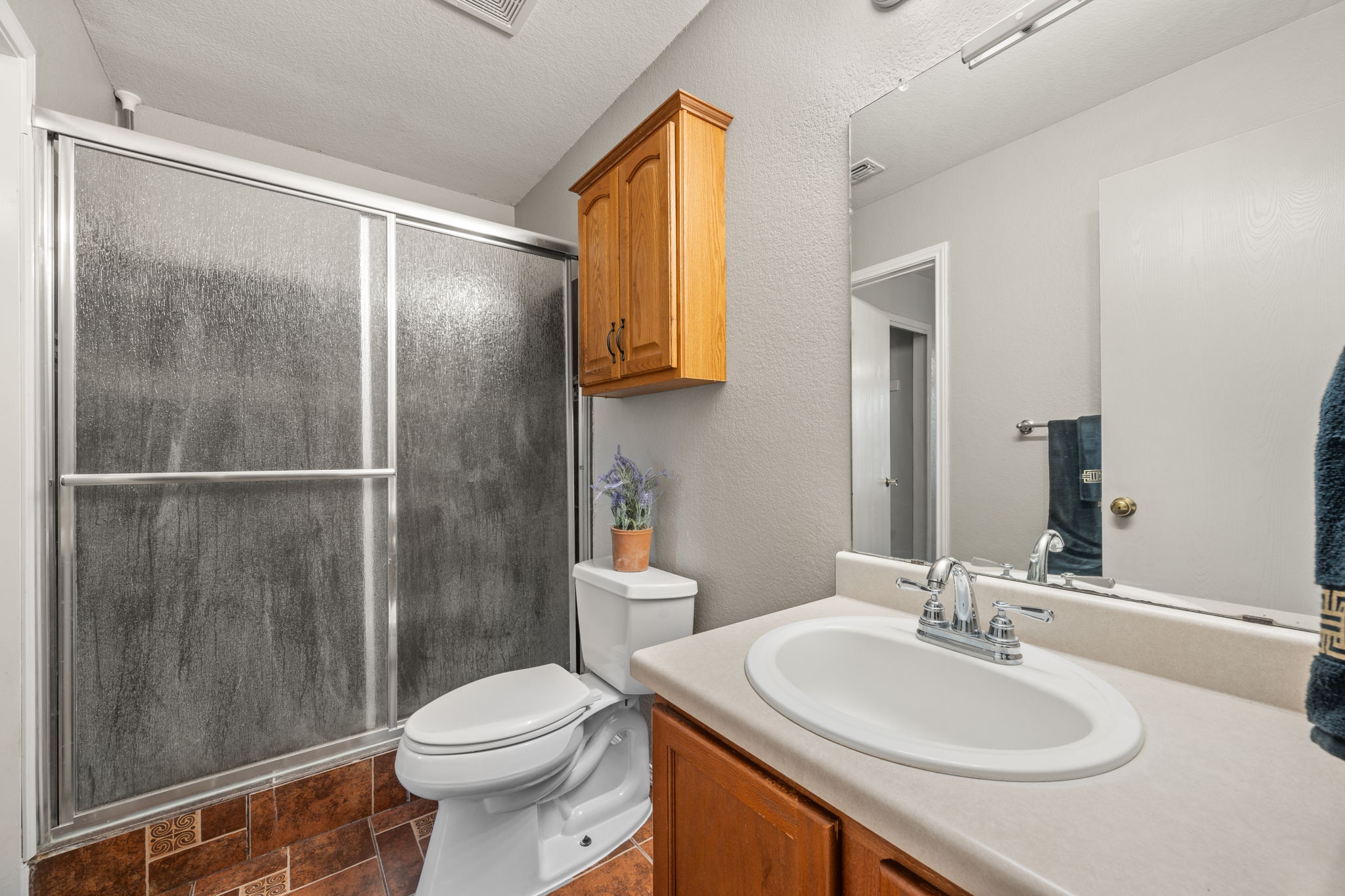 14206 Varrelman Street Austin, TX 78725 - Photo 16 of 27 a bathroom with a sink toilet and shower