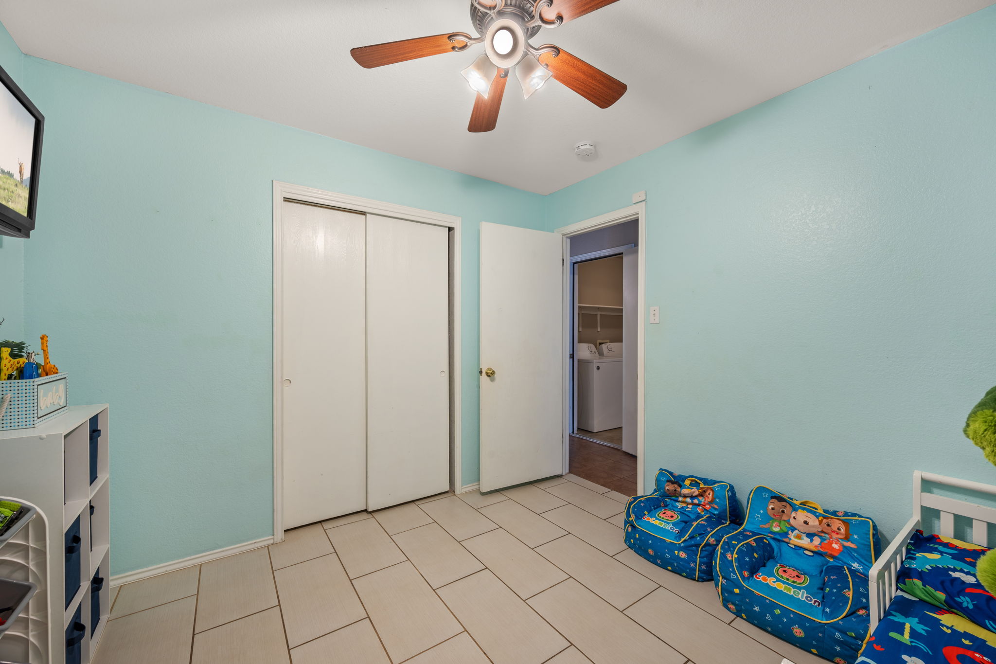 14206 Varrelman Street Austin, TX 78725 - Photo 20 of 27 a view of room with toys and a chandelier