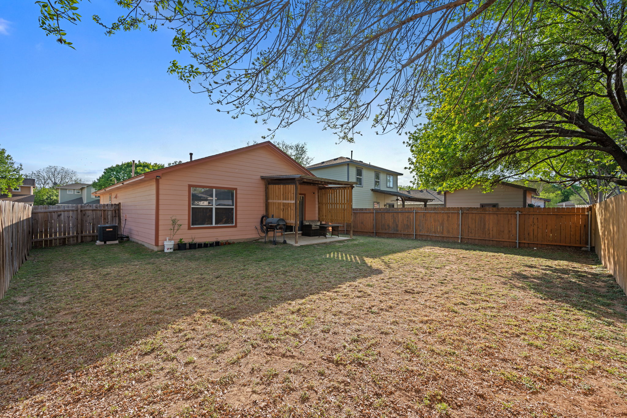14206 Varrelman Street Austin, TX 78725 - Photo 23 of 27 a view of a house with a yard